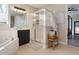 Bathroom featuring dual sinks, a walk-in shower, and soaking tub at 1909 Donahue Dr, Ocoee, FL 34761