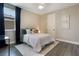 Cozy bedroom features neutral decor and ample natural light at 1909 Donahue Dr, Ocoee, FL 34761