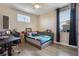 Cozy bedroom featuring a cool blue palette, natural light, and a functional desk area at 1909 Donahue Dr, Ocoee, FL 34761