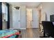 Bright bedroom featuring modern decor and an ensuite bathroom and closet at 1909 Donahue Dr, Ocoee, FL 34761