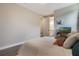 Secondary bedroom featuring a bed and ensuite bathroom at 1909 Donahue Dr, Ocoee, FL 34761