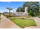 Elegant community entrance sign for 'Preserve at Crown Point' set amidst manicured landscaping at 1909 Donahue Dr, Ocoee, FL 34761