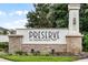 Close-up of the 'Preserve at Crown Point' community sign, highlighting the stone and stucco design at 1909 Donahue Dr, Ocoee, FL 34761