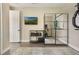 A clean and tidy exercise room with modern equipment and a mirrored accent wall at 1909 Donahue Dr, Ocoee, FL 34761