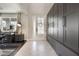 Elegant foyer featuring herringbone tile flooring, closet with storage, and a front door at 1909 Donahue Dr, Ocoee, FL 34761