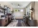 Bright home office with dual workstations, modern decor, and ample natural light at 1909 Donahue Dr, Ocoee, FL 34761