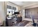 Stylish home office with a large window, modern furniture, and custom built-in storage at 1909 Donahue Dr, Ocoee, FL 34761