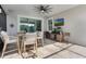 Covered patio featuring an outdoor dining set and TV area at 1909 Donahue Dr, Ocoee, FL 34761