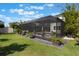 Beautiful backyard with a screened-in pool, lush lawn, mature plants and privacy, perfect for relaxing and entertaining at 1909 Donahue Dr, Ocoee, FL 34761