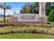 Preserve at Crown Point community sign surrounded by vibrant landscaping and lush greenery under a bright sky at 1909 Donahue Dr, Ocoee, FL 34761