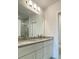 Bathroom vanity featuring granite countertops and dual sinks at 1912 Diamond Head Cir, Lake Hamilton, FL 33851