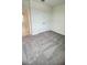 Comfortable bedroom featuring neutral carpet and a double door closet at 1912 Diamond Head Cir, Lake Hamilton, FL 33851