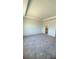Spacious carpeted bedroom with tray ceiling and ensuite bathroom at 1912 Diamond Head Cir, Lake Hamilton, FL 33851