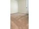 A neutral bedroom featuring carpet flooring, white walls, and a door at 1912 Diamond Head Cir, Lake Hamilton, FL 33851