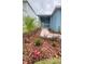 Charming front yard with lush, drought-tolerant landscaping and a welcoming entrance at 1912 Diamond Head Cir, Lake Hamilton, FL 33851