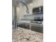 Close-up of kitchen sink featuring granite countertops and stainless steel faucet at 1912 Diamond Head Cir, Lake Hamilton, FL 33851