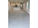 Bright open-concept living space with tile flooring and modern finishes at 1912 Diamond Head Cir, Lake Hamilton, FL 33851