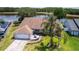 Aerial view of a single story home featuring well-manicured lawn and backyard pond at 1949 Tiptree Cir, Orlando, FL 32837