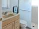 Bright bathroom featuring a glass door shower, neutral tiling, and a stylish framed mirror above the sink at 1949 Tiptree Cir, Orlando, FL 32837