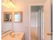 The bathroom vanity area features a view into a hallway and second bathroom, providing a sense of openness at 1949 Tiptree Cir, Orlando, FL 32837