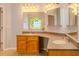 Bathroom with double sink vanity, a stained glass window, and decorative mirrors at 1949 Tiptree Cir, Orlando, FL 32837