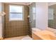 The bathroom has a shower with tiled walls, neutral flooring, a toilet, and a sink in the vanity area at 1949 Tiptree Cir, Orlando, FL 32837