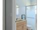 Bathroom featuring a vanity with mirror and a glass enclosed shower at 1949 Tiptree Cir, Orlando, FL 32837