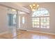 Bright and airy foyer featuring tile flooring, a chandelier, and view of the front yard at 1949 Tiptree Cir, Orlando, FL 32837