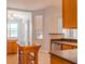 Spacious kitchen with wood cabinets, island with storage, lots of natural light and tile flooring at 1949 Tiptree Cir, Orlando, FL 32837