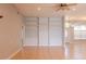 Bright living room with built-in shelving, tile floors, ceiling fan and large windows at 1949 Tiptree Cir, Orlando, FL 32837
