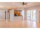 Open living space showcasing tile flooring, natural light, and seamless flow to kitchen and outdoor pool at 1949 Tiptree Cir, Orlando, FL 32837
