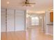Bright living room with built-in shelving, tile floors and views into the entry at 1949 Tiptree Cir, Orlando, FL 32837