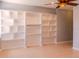 Living room with custom built-in shelving and a ceiling fan at 1949 Tiptree Cir, Orlando, FL 32837