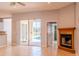 Bright living room with fireplace, access to the pool, and neutral wall color, enhancing the inviting atmosphere at 1949 Tiptree Cir, Orlando, FL 32837