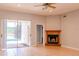 Open living area featuring tile flooring, fireplace, sliding glass doors to the pool, and neutral decor at 1949 Tiptree Cir, Orlando, FL 32837
