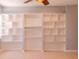 Bright living room with custom built-in shelving units and neutral wall color at 1949 Tiptree Cir, Orlando, FL 32837