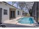 Screened in pool on the back porch area with access to the house through sliding glass doors at 1949 Tiptree Cir, Orlando, FL 32837