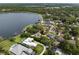 Stunning aerial view of lakefront homes showcasing lush landscaping, private docks, and the tranquil waterfront setting at 195 E Faith Ter, Maitland, FL 32751