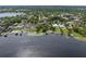 Aerial view showcasing waterfront homes, docks, and lake access at 195 E Faith Ter, Maitland, FL 32751