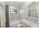 Bright bathroom featuring tub, shower, marble vanity, and decorative mirror at 195 E Faith Ter, Maitland, FL 32751