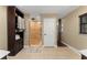 Bathroom featuring a walk-in shower, a linen closet, and neutral tile flooring at 195 E Faith Ter, Maitland, FL 32751
