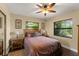 Comfortable bedroom featuring a ceiling fan, wood flooring and natural light at 195 E Faith Ter, Maitland, FL 32751