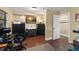 Bonus room featuring dark cabinets, wood floors, and neutral paint at 195 E Faith Ter, Maitland, FL 32751
