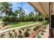 Well-manicured front yard with lush landscaping, a walkway, and beautiful curb appeal at 195 E Faith Ter, Maitland, FL 32751