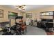 Home gym featuring a treadmill, weights, fan, and windows at 195 E Faith Ter, Maitland, FL 32751