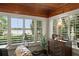 Bright sunroom with paneled ceiling, large windows and lake views at 195 E Faith Ter, Maitland, FL 32751