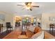 Open-concept living area with hardwood floors and a bright dining space at 195 E Faith Ter, Maitland, FL 32751