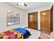 Bedroom with ceiling fan, carpet floors, closet, window, and furnishings at 2007 Peach Tree Blvd, St Cloud, FL 34769