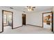 Large bedroom with a ceiling fan and multiple doorways leading to en-suite and walk-in closet at 2007 Peach Tree Blvd, St Cloud, FL 34769