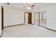 Bedroom showcasing natural light, ceiling fan, and direct access to a covered outdoor area at 2007 Peach Tree Blvd, St Cloud, FL 34769